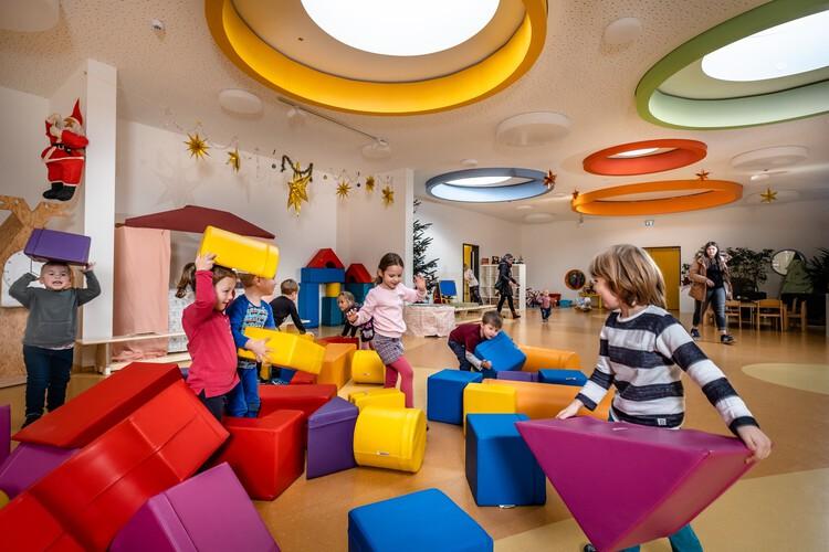 children playing with colorful blocks