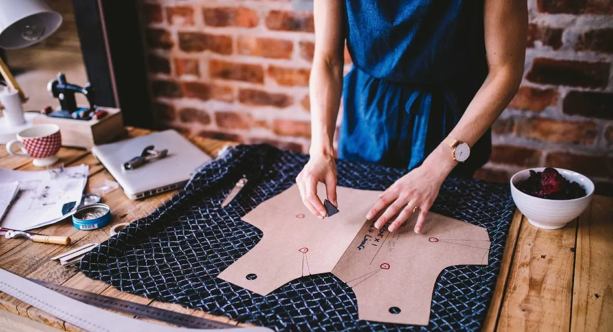 Artisan working on fabric pattern design